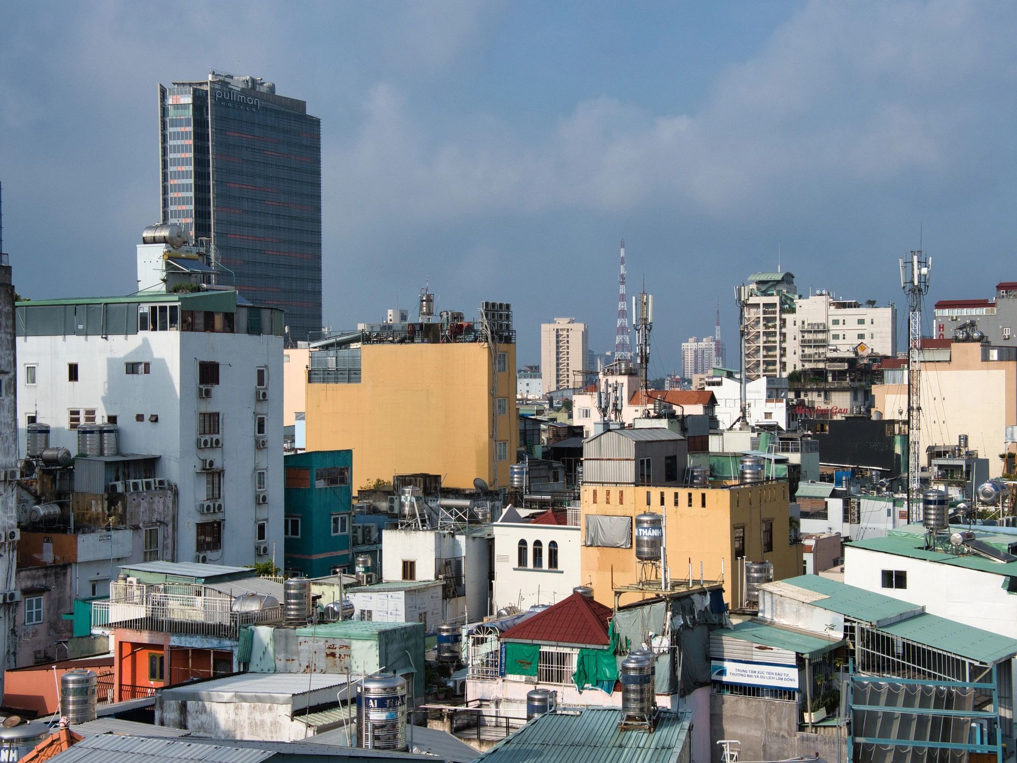 Dense Ho Chi Minh City residential skyline under blue sky