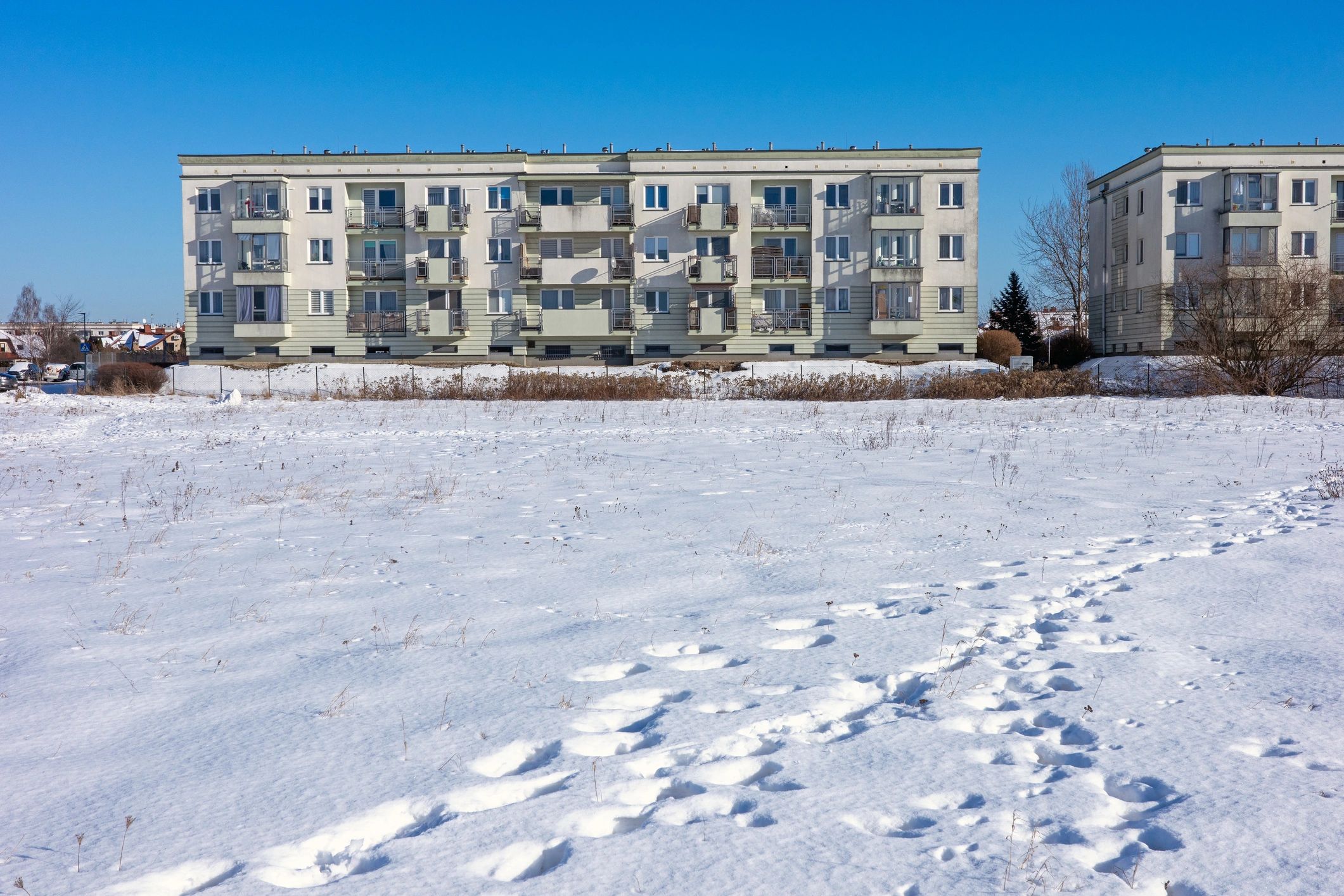 Modern apartment building exterior representing a property listing submission
